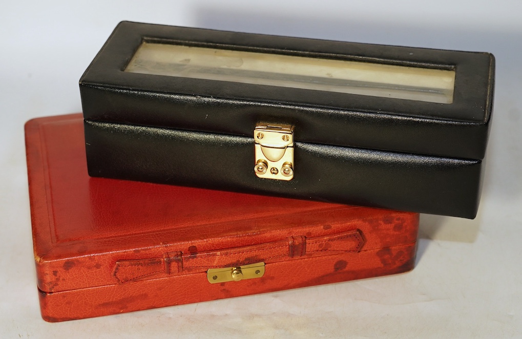 A Geoffrey Parker red leather backgammon set and a black leatherette wrist watch case